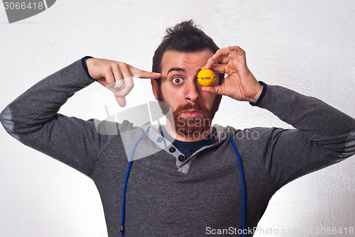 Image of amazed man point at golf ball