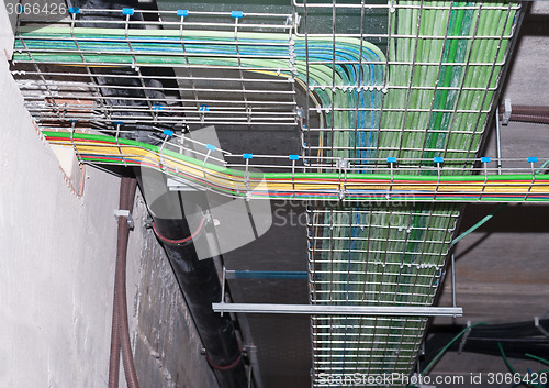 Image of Multicolored pipes and wires silver vents of industrial faclity