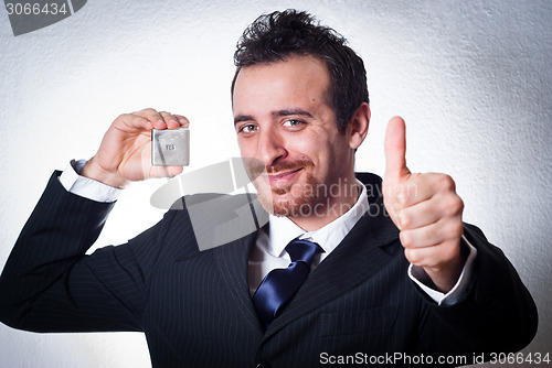 Image of happy business man going thumbs up