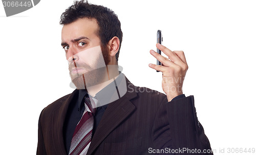 Image of businessman puts his phone away from his ear