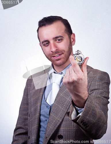 Image of elegant man looking his old pocket watch