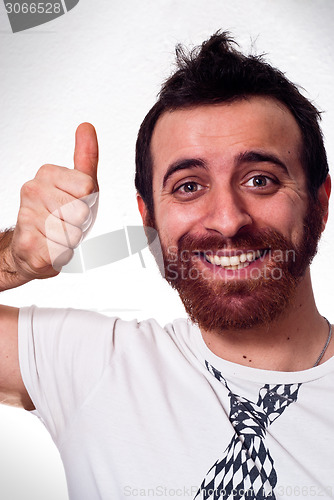 Image of happy young man showing thumb up sign