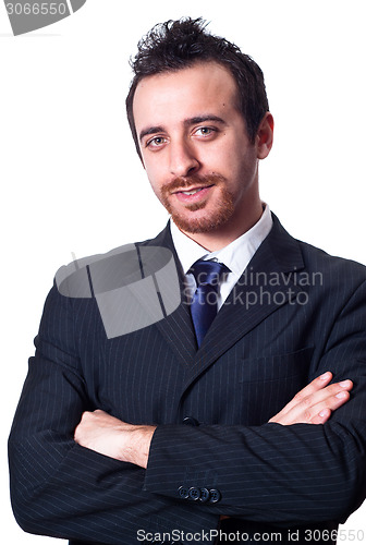 Image of Portrait of a confident businessman with folded arms