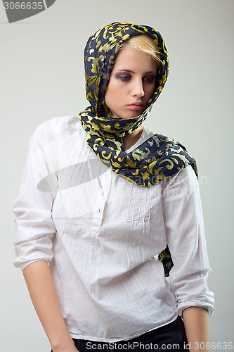 Image of attractive blond girl in scarf and white shirt