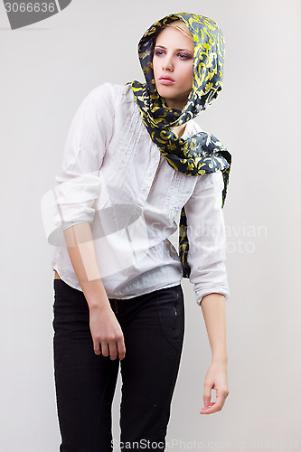 Image of attractive blond girl in scarf and white shirt