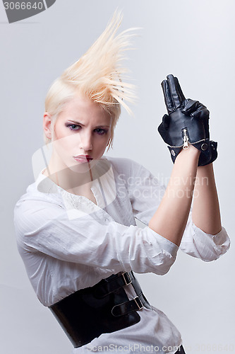 Image of attractive blond girl with gun