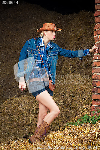 Image of attractive cowboy girl in village