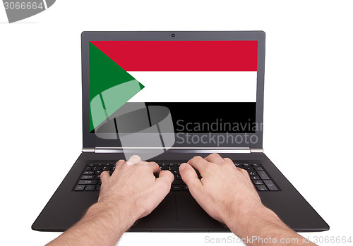 Image of Hands working on laptop, Sudan