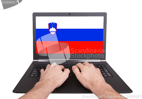 Image of Hands working on laptop, Slovenia