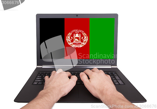 Image of Hands working on laptop, Afghanistan