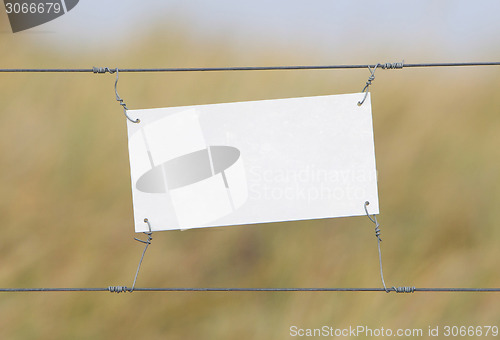 Image of Border fence - Old plastic sign