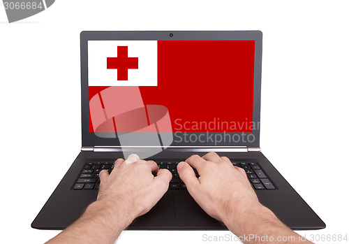Image of Hands working on laptop, Tonga