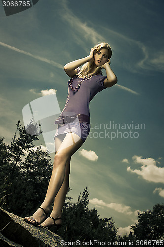 Image of blond girl in purple dress