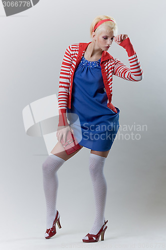 Image of emotion pose blond girl in red woolly