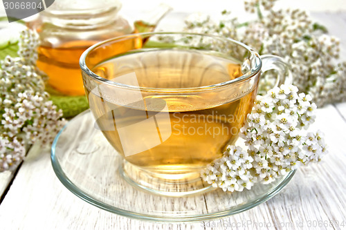 Image of Tea with yarrow in cup on light board