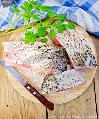 Image of Bream crude pieces with napkin on board