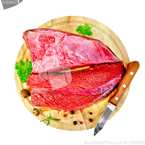 Image of Meat beef with parsley on round board top