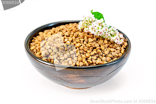 Image of Buckwheat in brown bowl and flower