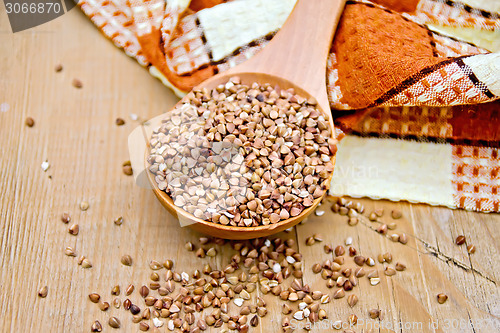 Image of Buckwheat in spoon and napkin on board