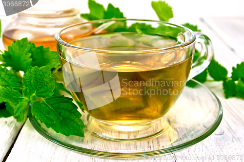 Image of Tea with melissa in cup on light board