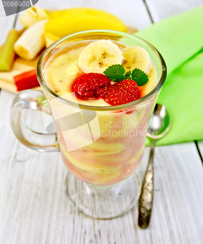 Image of Dessert milk strawberry and banana on board with napkin