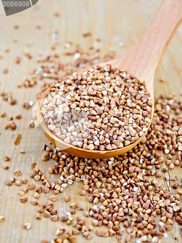 Image of Buckwheat with spoon on wooden board