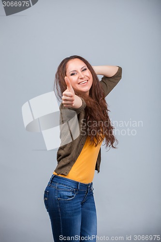 Image of Woman showing thumbs up