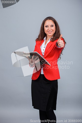 Image of Young attractive girl in red with folders