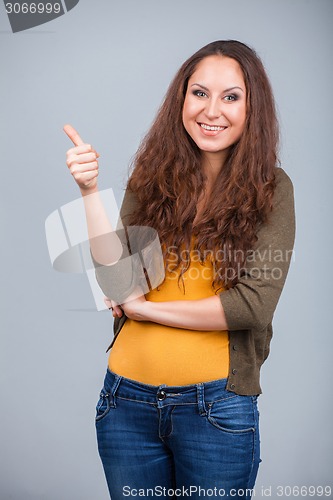 Image of Woman showing thumbs up