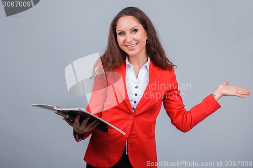 Image of Young attractive girl in red with folders