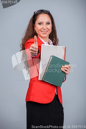 Image of Young attractive girl in red with folders
