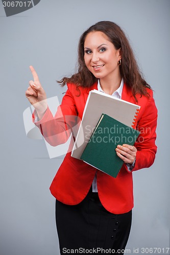 Image of Young attractive girl in red with folders