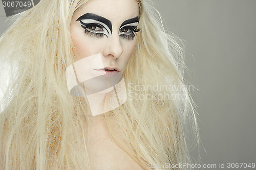 Image of beautiful blond girl with cat eyes make-up