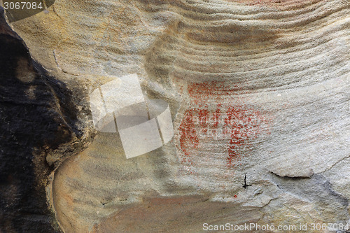 Image of Prehistoric aboriginal hand print using red ochre Australia