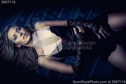 Image of attractive lying girl in lingerie