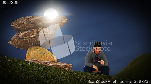 Image of Young man  talking on his mobile 