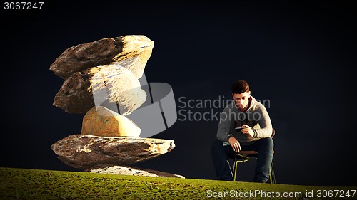 Image of Young man  talking on his mobile 