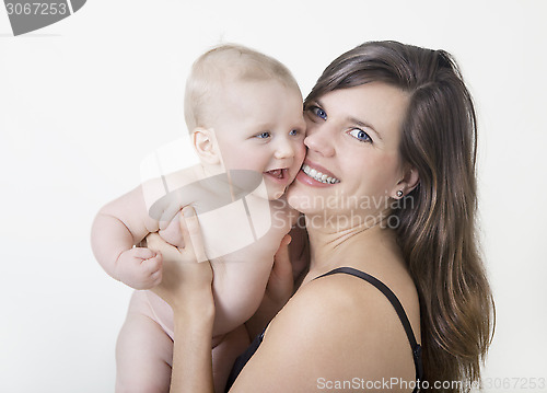 Image of mother laughs with baby