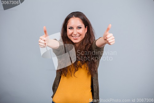 Image of Woman showing thumbs up