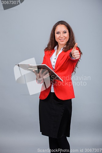 Image of Young attractive girl in red with folders