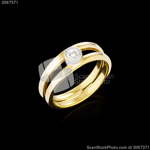 Image of Gold Diamond ring on black background