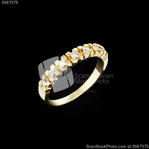 Image of Gold Diamond ring on black background