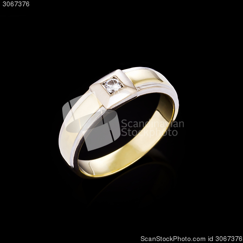 Image of Gold Diamond ring on black background