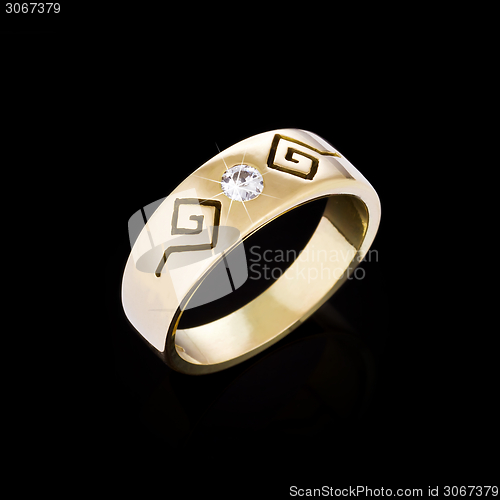 Image of Gold Diamond ring on black background