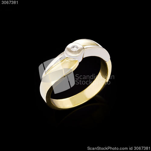 Image of Gold Diamond ring on black background