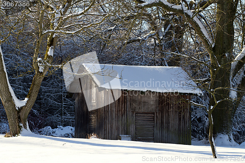 Image of Landscape with wooden shack in the snow
