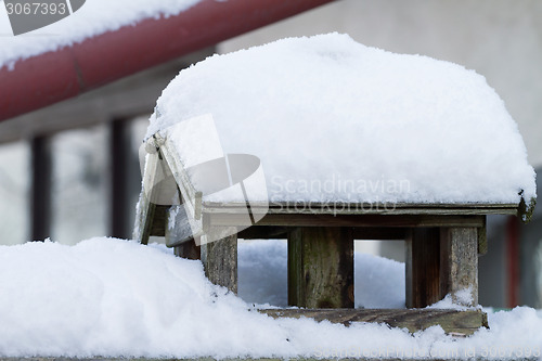 Image of Bird house with snow cover