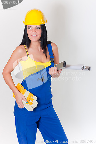 Image of working girl in yellow helmet