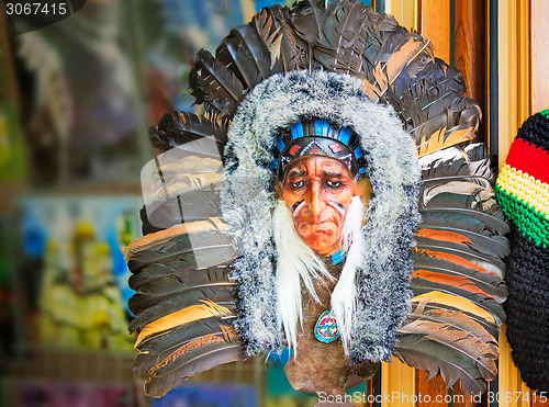 Image of Mask Indians, decorated with fur and feathers.