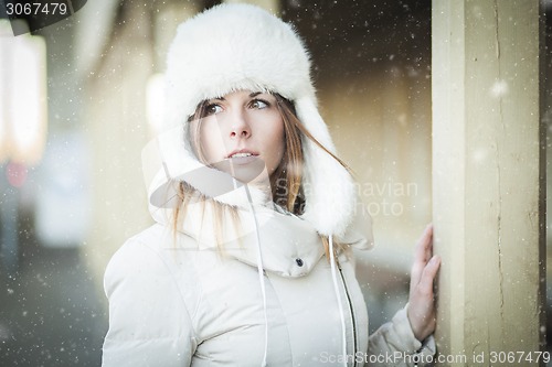 Image of Winter girl in warm clothes snowy day